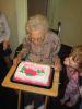 Blowing out the candle.
