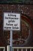 Wismar - Warning sign at Marien church warning of avalanches from roof.